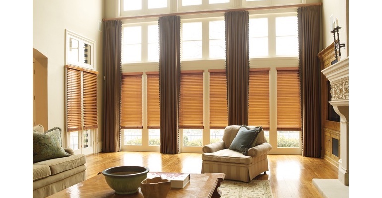 St. George great room with natural wood blinds and floor to ceiling drapes.
